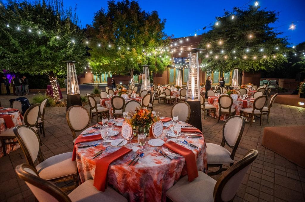 Outdoor evening event with string lights